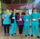 Image show a group of medical staff standing outside an emergency department reception