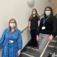 The women wearing masks while stood on the stairs