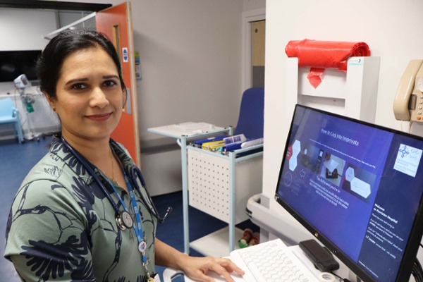 Image shows a doctor on a hospital ward.