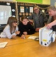 Image shows children looking at a medical device