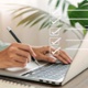 A person typing on a laptop