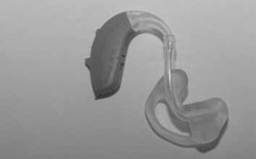 Image shows the full hearing aid with the new tubing and ear-mould attached.