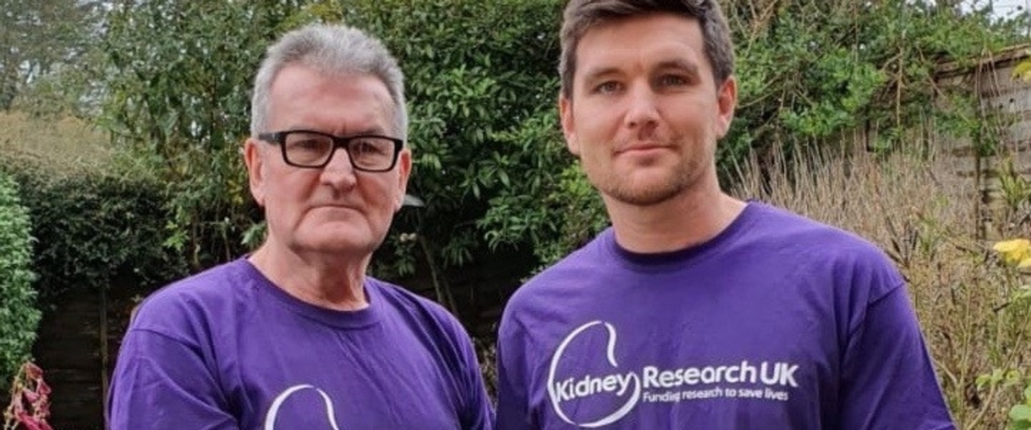 Geoff Walker, activities coordinator at Caswell Clinic with son Andy, wearing purple Kidney Research UK t-shirts.