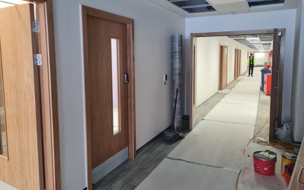 A picture of a corridor under construction