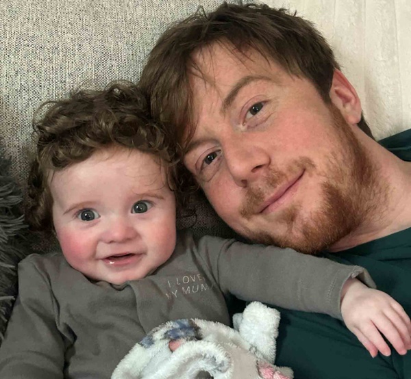 Image of a baby with his father.