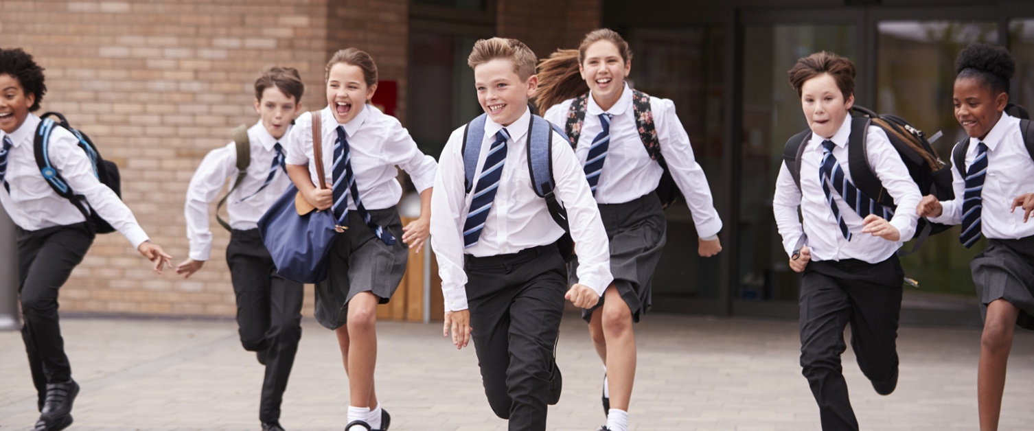An image of secondary school pupils running.