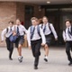 An image of secondary school pupils running.