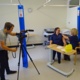 Nurse Sam Robinson receives her flu vaccination from Senior Nurse Dawn Williams while they are filmed by Joe O’Hagan, AV senior production officer for NHS Employers.