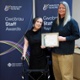 Maura Walsh and Julia stand together holding the Patient Choice Award certificate.