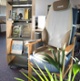 A quiet area in a library with books and plants