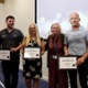 Group image with reward recipients holding their certificates.
