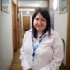 Laura stood in a corridor