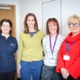 Kate, Georgina, Fiona and Beth stood in an office