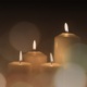 An image of three memorial candles
