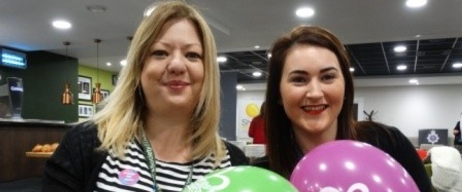 Rebecca Jenkins and Ashley Bryant of the Alzheimers Society holding balloons