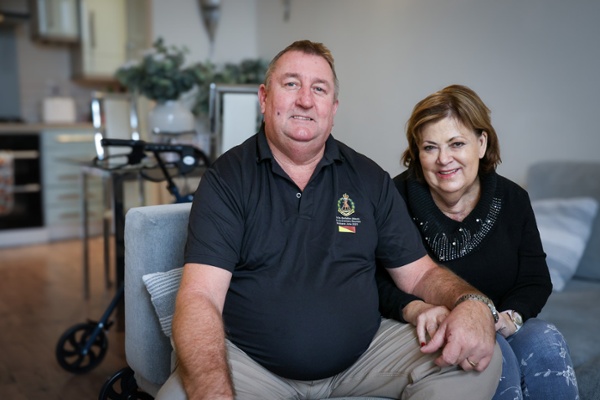 Image shows a man and woman sitting down