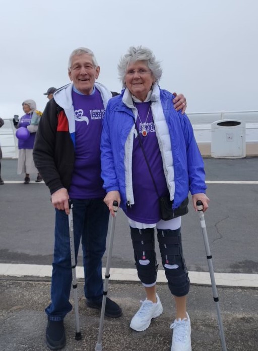 A man and woman stood next to each other on a promenade