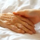  picture of a person holding an older person