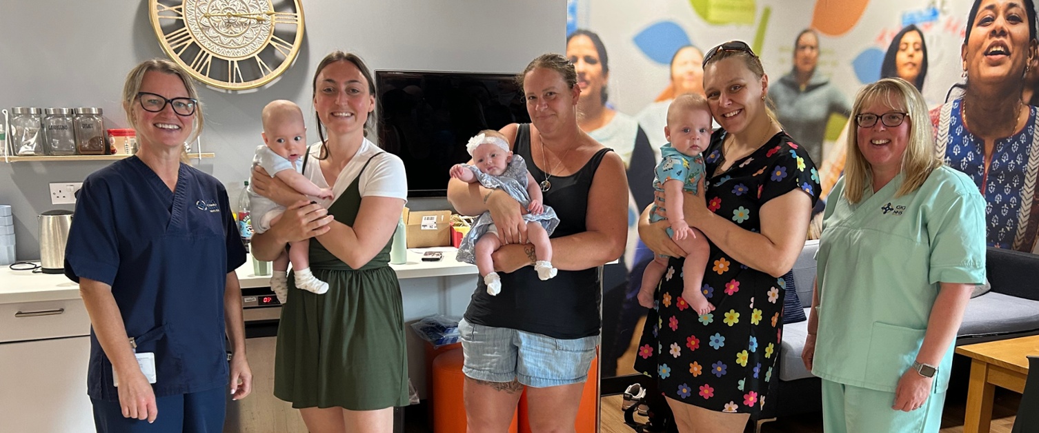 Natasha and Isabel stood with some mums and their babies