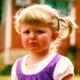 A young girl who is very unhappy and having a tantrum