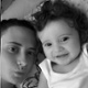 Black and white image of a mother and baby.