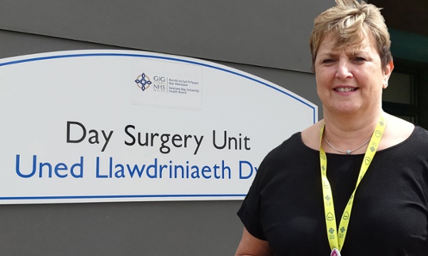 Image shows Jan Worthing outside the Day Surgery Unit