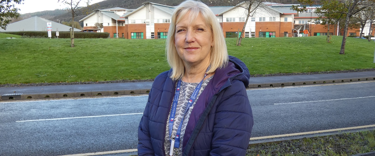 Chris Cottrell standing in front of Neath Port Talbort Hospital