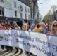 Members of staff marching in a pride event