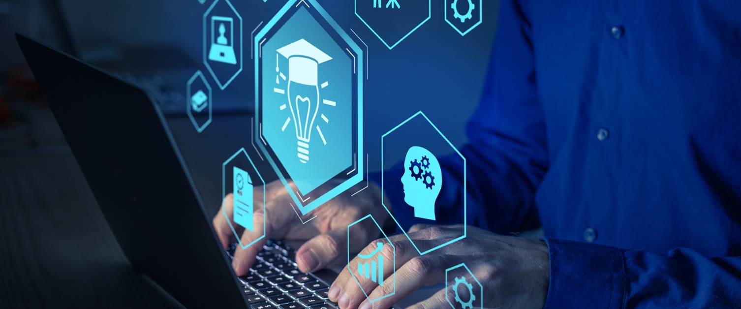 Hands on a laptop keyboard.