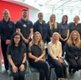 Aelodau o staff yn sefyll gyda