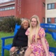 Image shows two women sitting on a bench