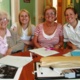 A group of women smiling at the camera