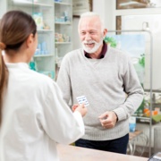 pharmacist serving patient adobe