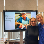 Sharon and Katie with picture in background.png