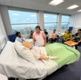 Image shows nurses training with a mannequin