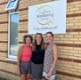 Emma, Rachel a Lois yn sefyll y tu allan i Ganolfan Llesiant Abertawe