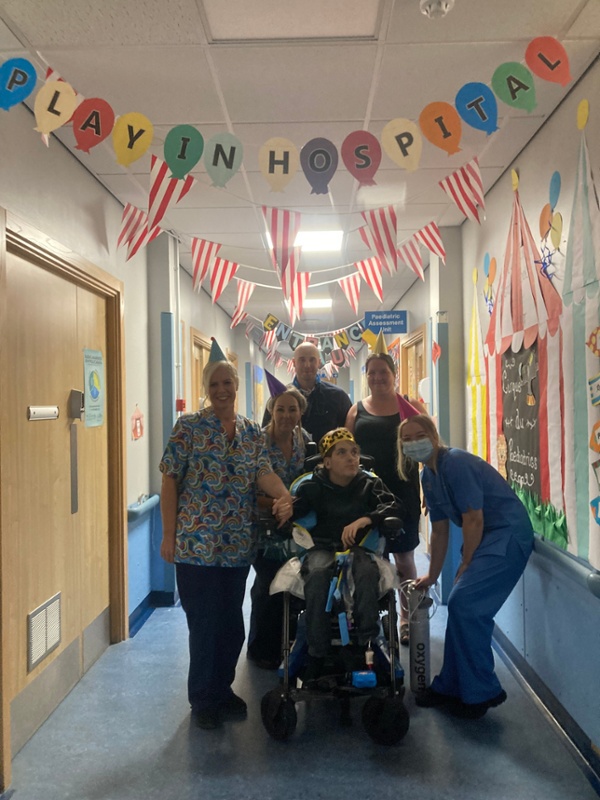 Group in decorated hospital corridor 
