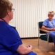 Neath Port Talbot Hospital counsellor Lynda Mizen talks to a colleague