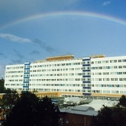 Image of outside Singleton hospital with a rainbow in the sky.