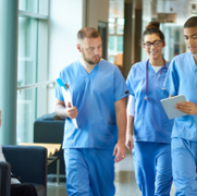 3_medics_blue_uniform_walking_in_corridor.png