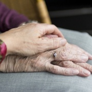 Elderly_person_holding_hand.jpg