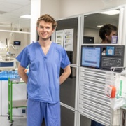Green Ben Prince, Anaesthetics Sustainability Clinical Fellow with Omnicell machine.jpg