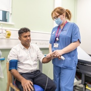 Staff_Nurse_Charlene_Simmonds_inspects_a_patient_on_the_new_unit_The_Grange_University_Hospital_ABUHB_50.jpg