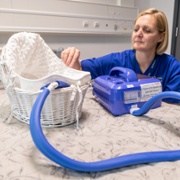 Bereavement Midwife Louise Howells sets up the new CuddleCot, a portable cooling system - ABUHB, Doug Evens.jpg
