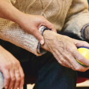 Elderly_man_holding_stress_ball.png