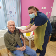 Mr Ernie Jones receiving his vaccination