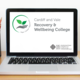 Cardiff and Vale Recovery & Wellbeing College Logo on a Laptop.