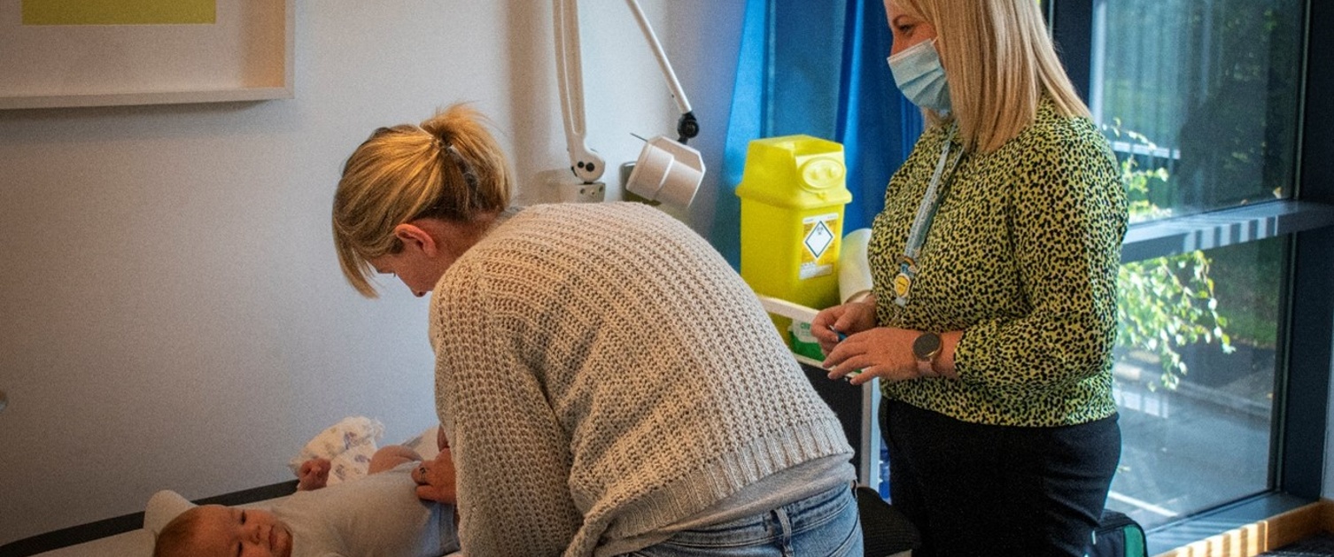 A mother and baby at a doctors appointment.