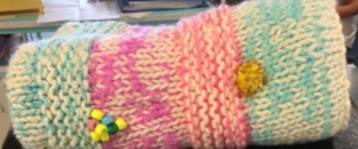 a knitted hand warmer