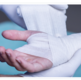Image of a wrist being bandaged.